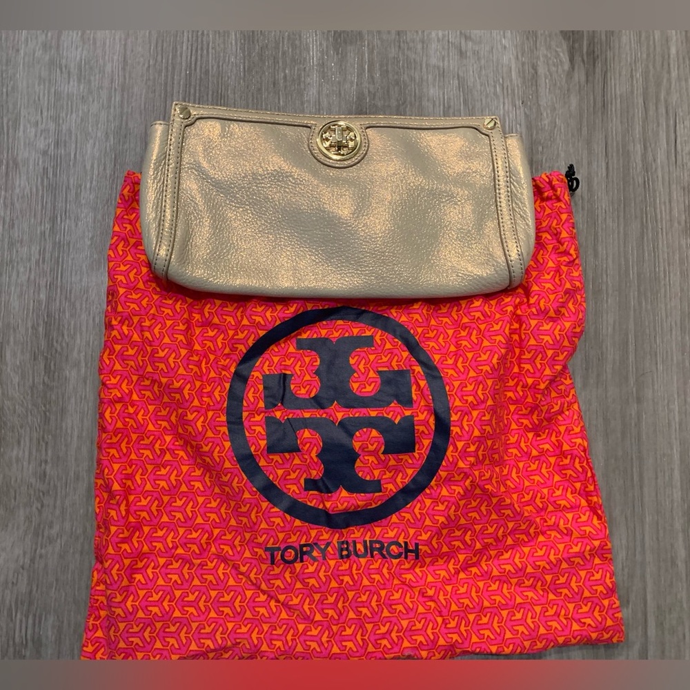 Beautiful gold Tory clutch bag